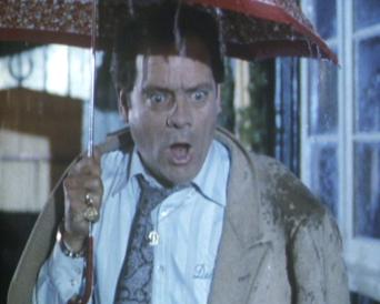 Del under an umbrella in Friday the 14th Only Fools and Horses